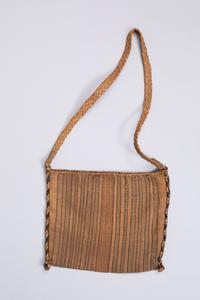 Bag  
Bast   
24 × 20 cm (without strap)  
Geographical allocation: Cameroon  
DM VI 08
Object description  
Bag made of raffia. Bag made of double layered braided mat (colored longitudinal stripes); braided at side edges with two-tone (brown/natural) braided cord closed carrying strap.
Provenance  
Kunstmuseen Krefeld (since 1923); Deutsches Museum für Kunst in Handel und Gewerbe (until 1923); previous owner (unknown); transfer to Germany (unknown); appropriation in region of origin (unknown); manufacture (unknown).
Object History  
Hagen-born art patron Karl Ernst Osthaus founded the German Museum of Art in Trade and Commerce in 1909 with the support of the Deutscher Werkbund. With the museum, Osthaus pursued the goal of achieving an aesthetic imprint on industrial product design by creating and lending exemplary decorative arts. To this end, the museum lent traveling exhibitions to interested institutions in German-speaking countries and beyond. In 1911, an exhibition on "Exotic Braided Works," which were also promoted as "examples of good craftsmanship," was added to the program. For the "Braided Works Exhibition," objects were obtained through art and ethnographic dealers such as J.F.G. Umlauff, Bruno Antelmann (Deutsches Kolonialhaus), and Rex & Co. So far, however, it remains unclear through whom the companies obtained the objects they offered for sale, and thus also how these objects were extracted from their warehouses, most of which were under European colonial ownership. The bag can probably be located in this context. 
The bag is described as a "hunting bag" in a list of objects made on the occasion of lending the wickerwork exhibition to Magdeburg. In fact, the intended use of such bags was much broader. They were made for functional purposes as well as for ritual use and are still used today in travel, agriculture and ceremonial contexts.