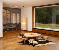 Charlotte Perriand. L’Art d’habiter / The Art of Dwelling  
Installation view at Haus Lange  
Rio coffee table, Cassina prototype  
Tabouret Berger stools - Cassina iMaestri Collection  
© VG Bild-Kunst, Bonn, 2025  
Photo: Dirk Rose